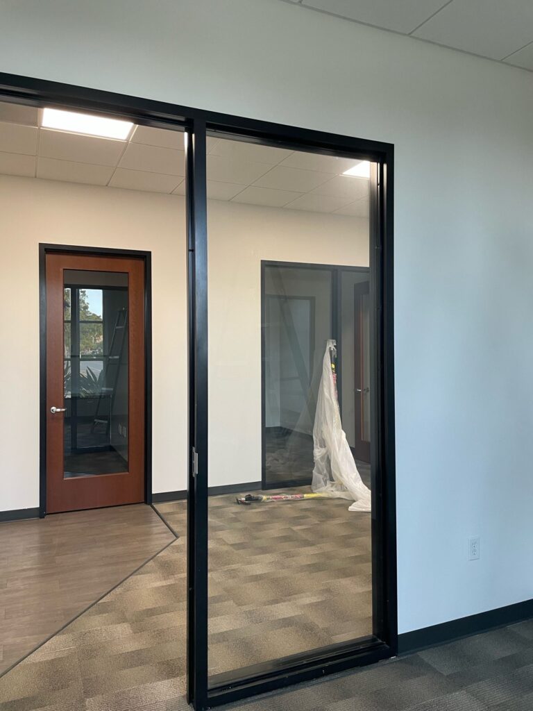 New framed glass doors installed in a commercial interior
