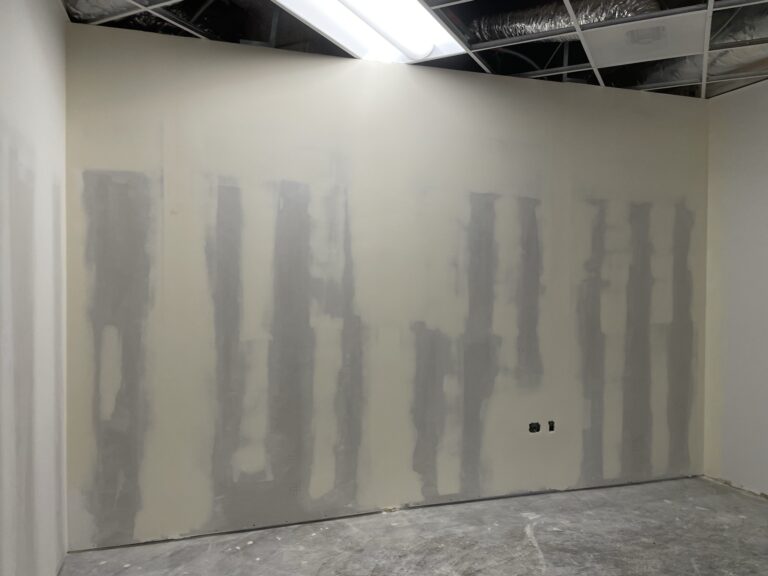 Drywall taping and finishing inside a commercial tenant improvement